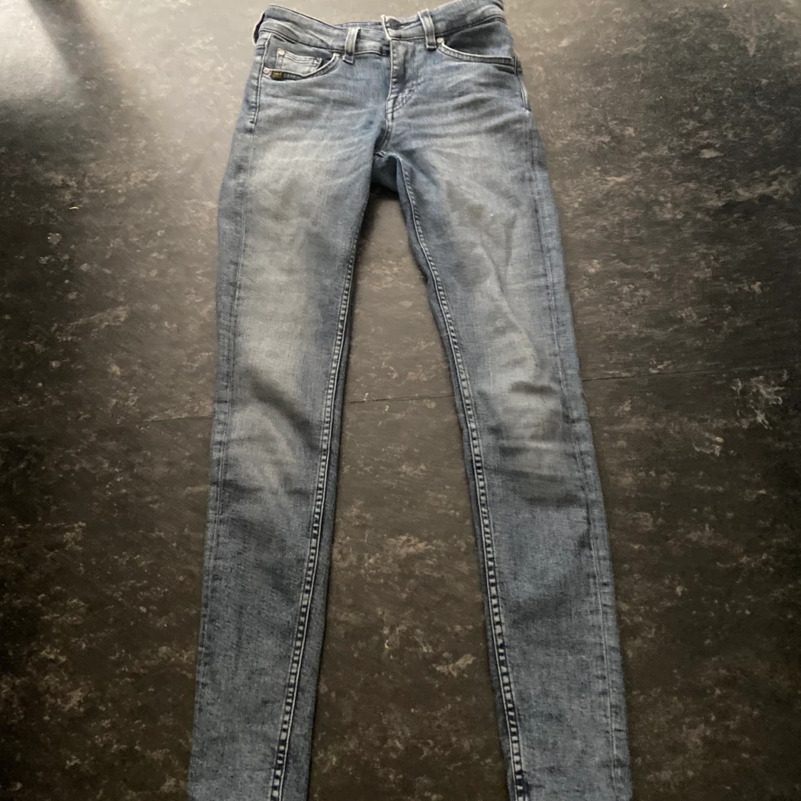 Ett par  låg midjan vintage jeans i storleken xs