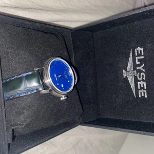 ELYSEE - En oanvänd klocka från ELYSEE, lapp kvar samt boxen man får den i!