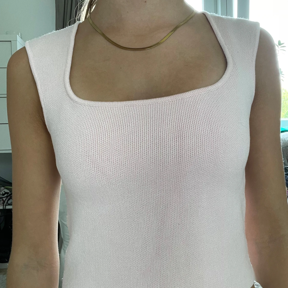 Ljusrosa stickad linnetopp