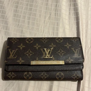 Plånbok - Helt ny! Har massa fack.