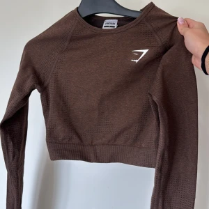 Gymshark tröja  - Brun gymshark tröja som är använd 1 gång💕