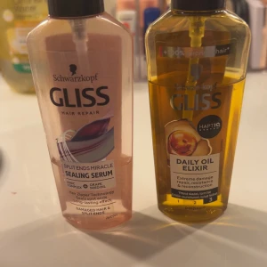 Hårolja - Två håroljor från Gliss ena är mindre än halva och den andra är ner, (ni ser i bilden).
