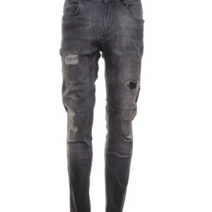 Svarta slitna jeans - Snygga svarta jeans med slitningar på låren och knäna. De har en tight passform och är perfekta för en trendig look. Jeansen har en klassisk femficksdesign och är tillverkade i ett stretchigt material för extra komfort.