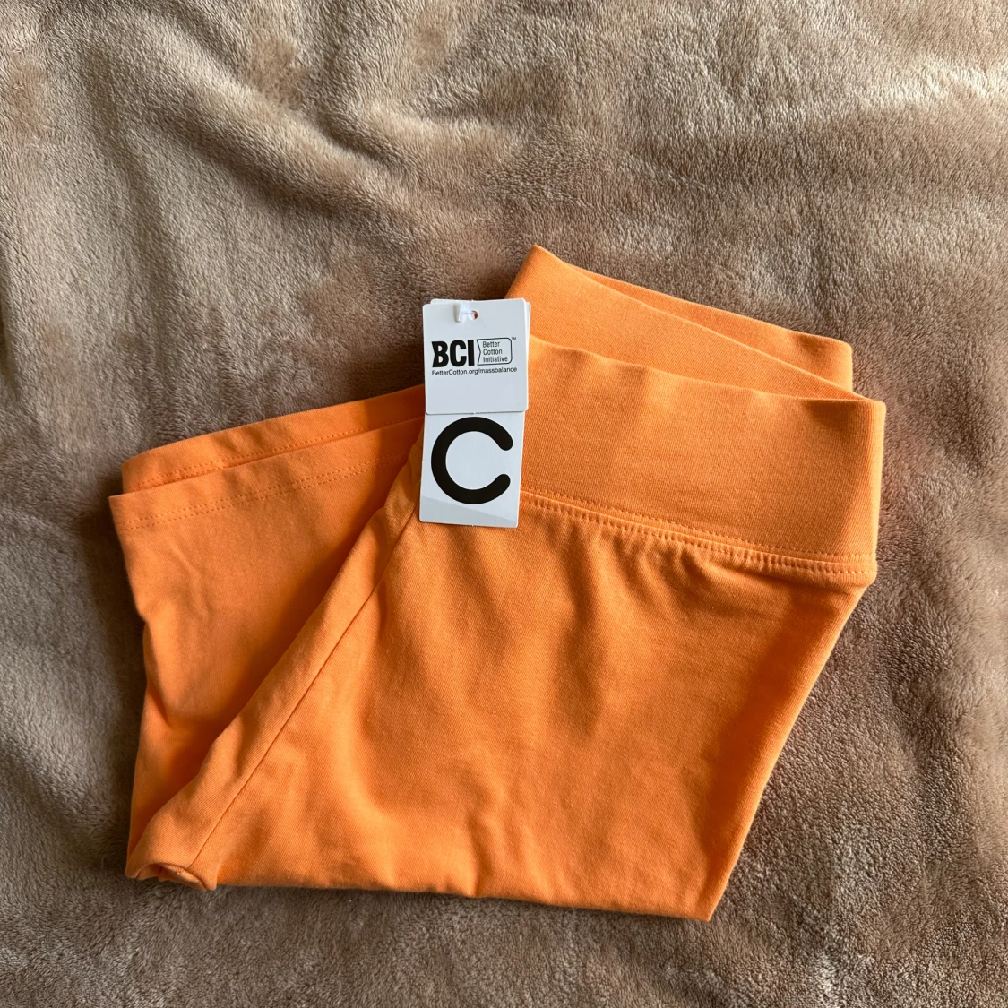 Orange cykelbyxor NY med prislapp - 1