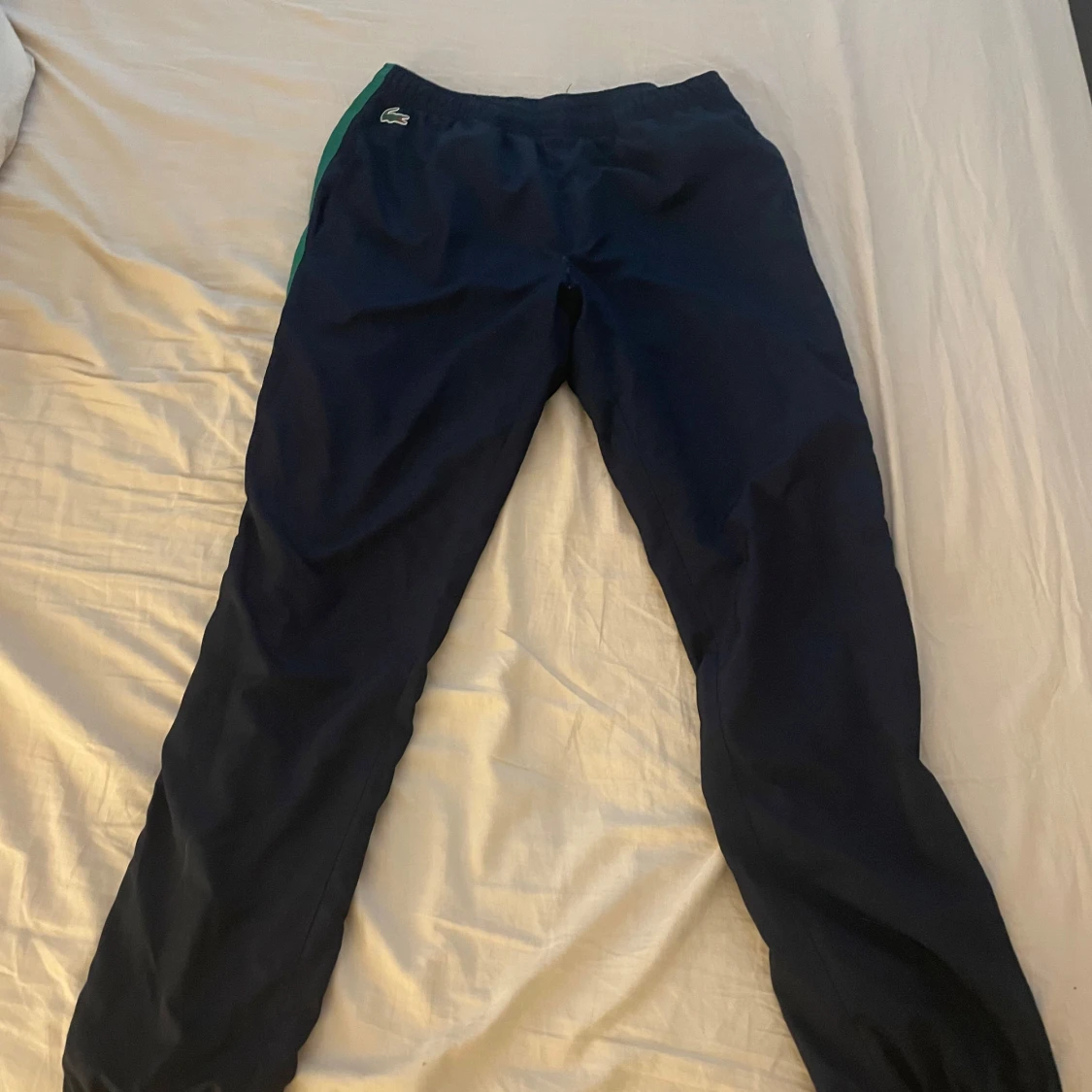 Blå träningsbyxor från Lacoste - 1