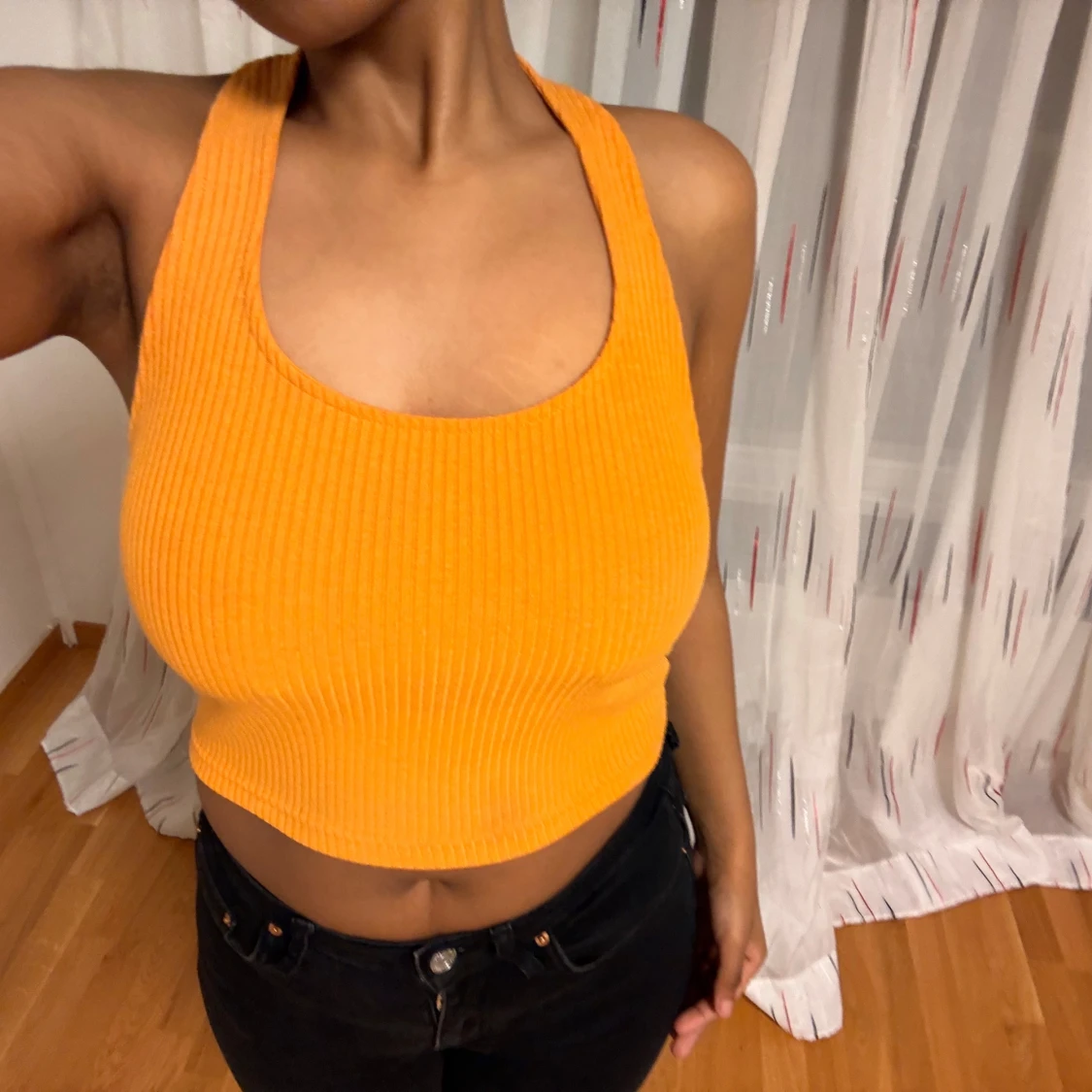 Orange ribbad linnetopp