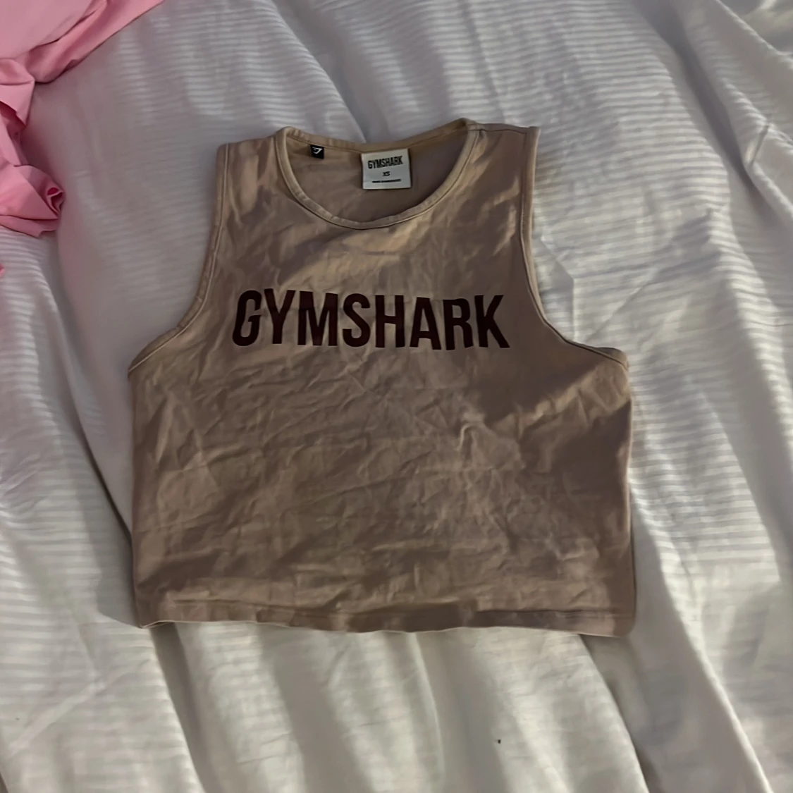 Beige croppad linnetopp från Gymshark