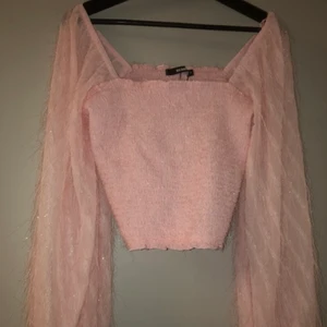 Rosa topp - Rosa topp med ballong ärmar och skimmer