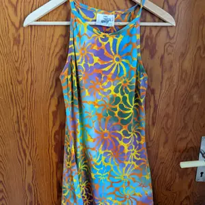 This is my mom's from when she was my age so truly from the 70s. It is still so bright and colourful. I never wear it so it's looking for a new home and owner. It's been really well looked after and is in great condition