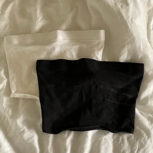 Bandeautoppar  - 2 fina bandeautoppar från H&M. Köpta på rea så därmed fläckarna på den svarta. Väldigt små i storleken. 