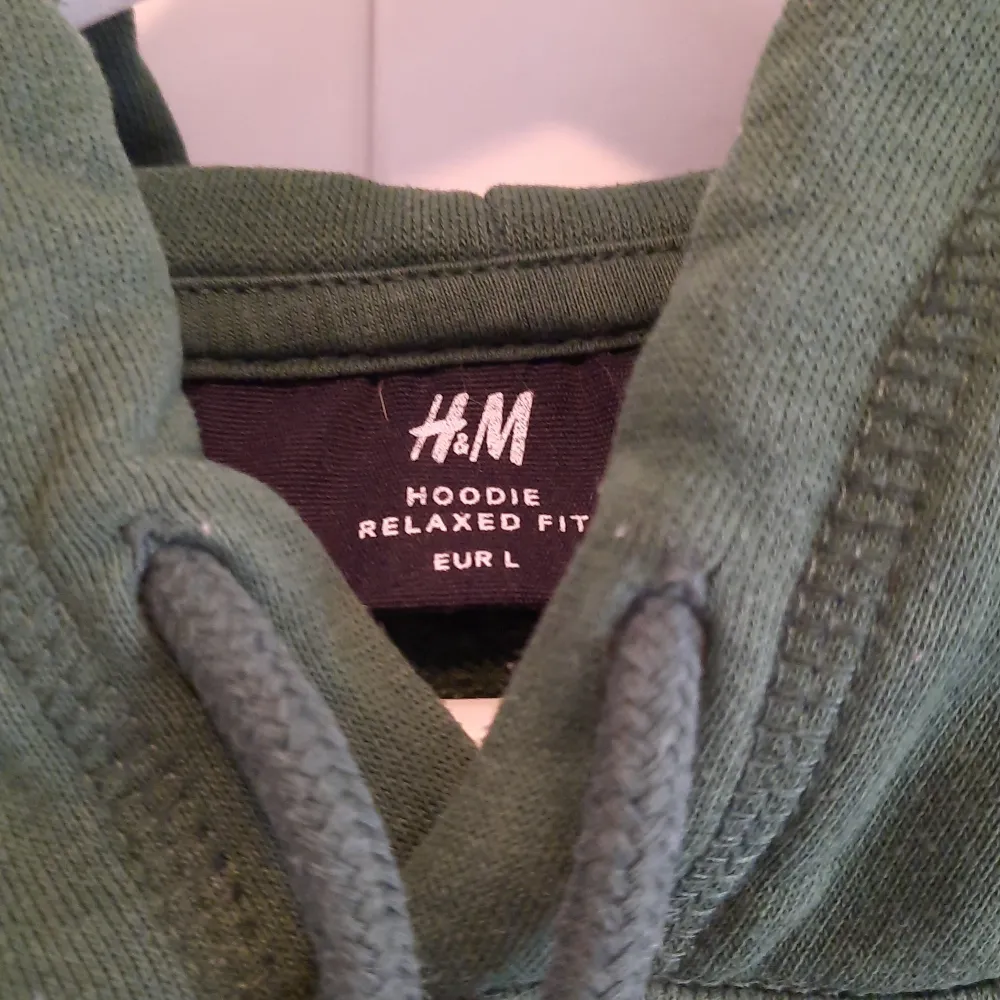 Grön hoodie från H&M storlek large relaxed fit. Hoodies.
