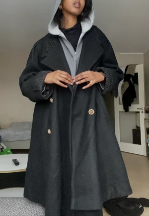 Detailed Black Vintage Coat - Barely worn, high quality, black thick coat with vintage gold buttons and detailing on the collar and cuffs. 