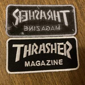 Thrasher logo tygmärke