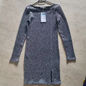Grey glitter dress. Size L Price 250 sek.
