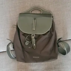 Stylish backpack with one exterior zipper pocket and one interior zipper pocket. Lightly used, good condition. Original product price: 1650€  Imperfection: was a gift, gift giver packed it poorly, so the leather cover has creases