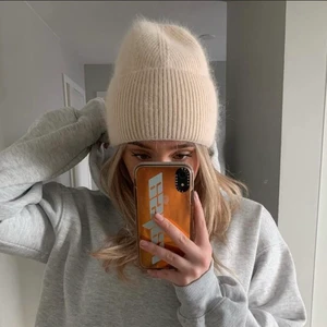 Sandvit mössa från Alvii - Använd 1 gång 