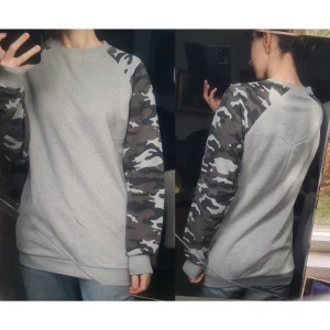 Collegetröja camouflagemönstrad grå S - Fint skick. 93% bomull, 7% polyester. Vidd: 43-48, längd: 73, ärmlängd: 73.