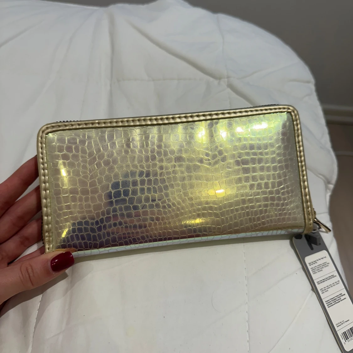 Glittrig guldplånbok med dragkedja