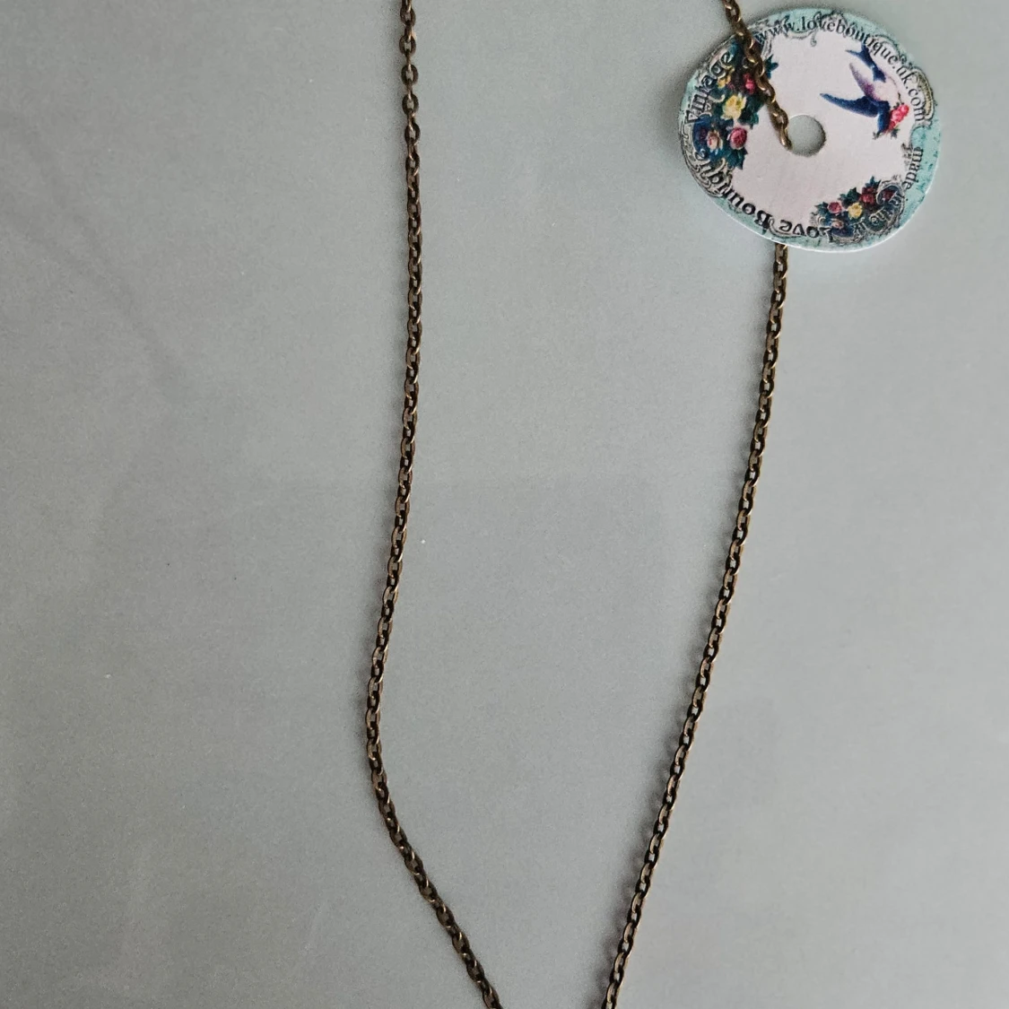 Halsband med hjärtberlock