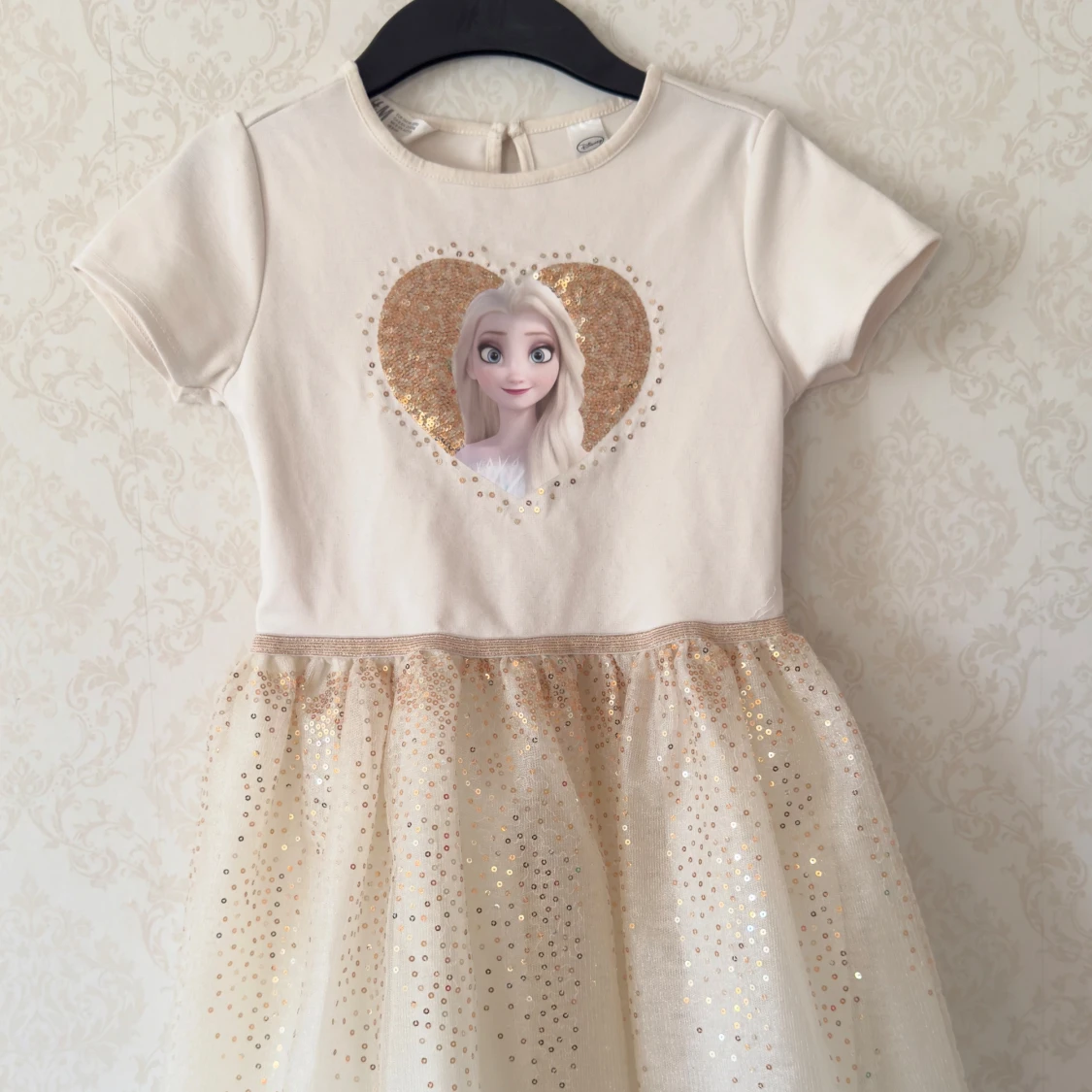 Vit ”Frozen” klänning med glittrig kjol - H&M