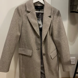 Kappa  - Oanvänd kappa från vero Moda 