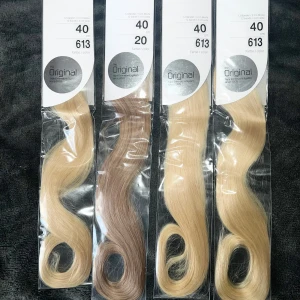 Hårförlängningar från Hairtalk - Säljer flera paket av Hairtalk hårförlängningar i olika blonda nyanser. Längden är 40 cm och färgkoderna inkluderar 613 och 20. Perfekt för att ge ditt hår extra volym och längd.