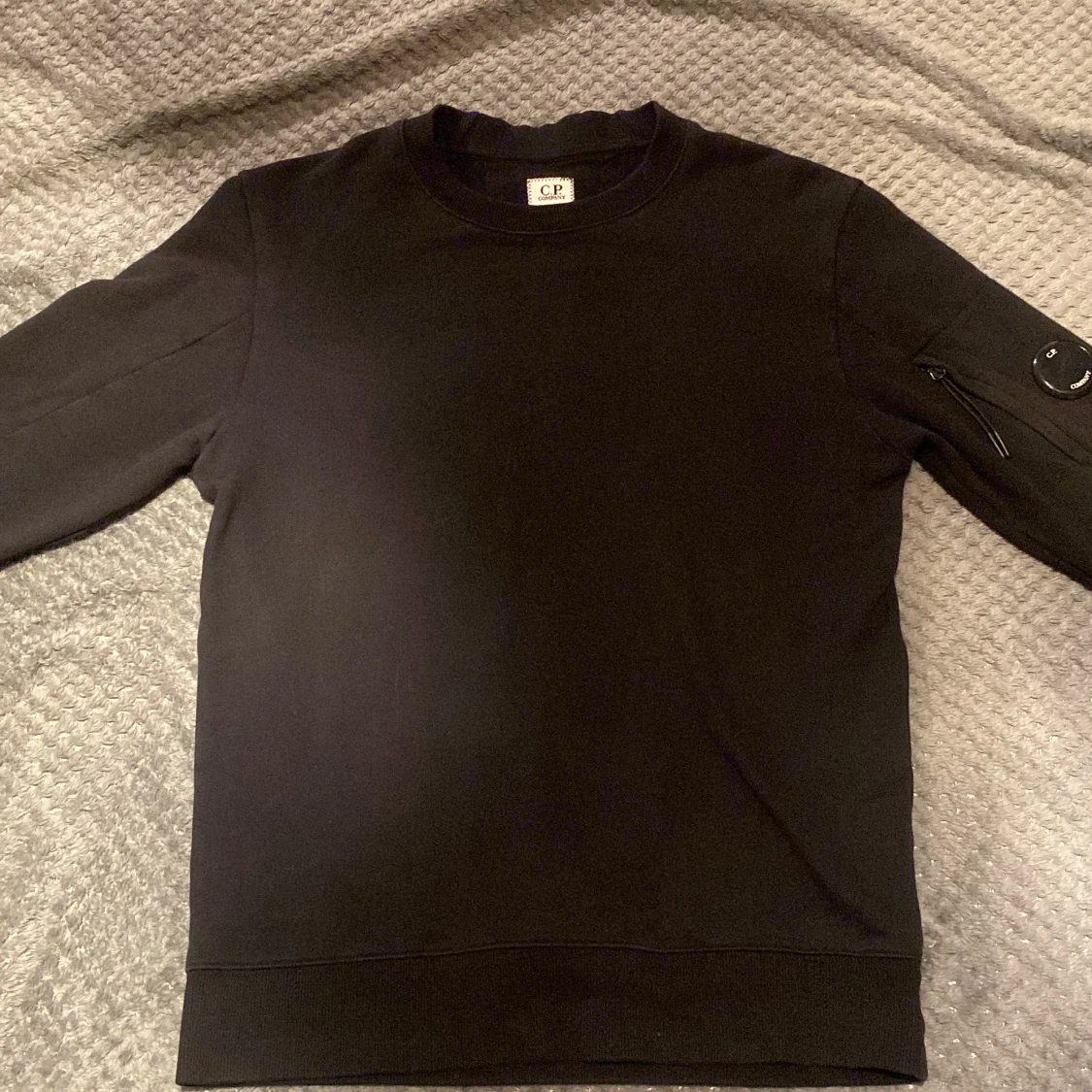 Svart sweatshirt från C.P. Company