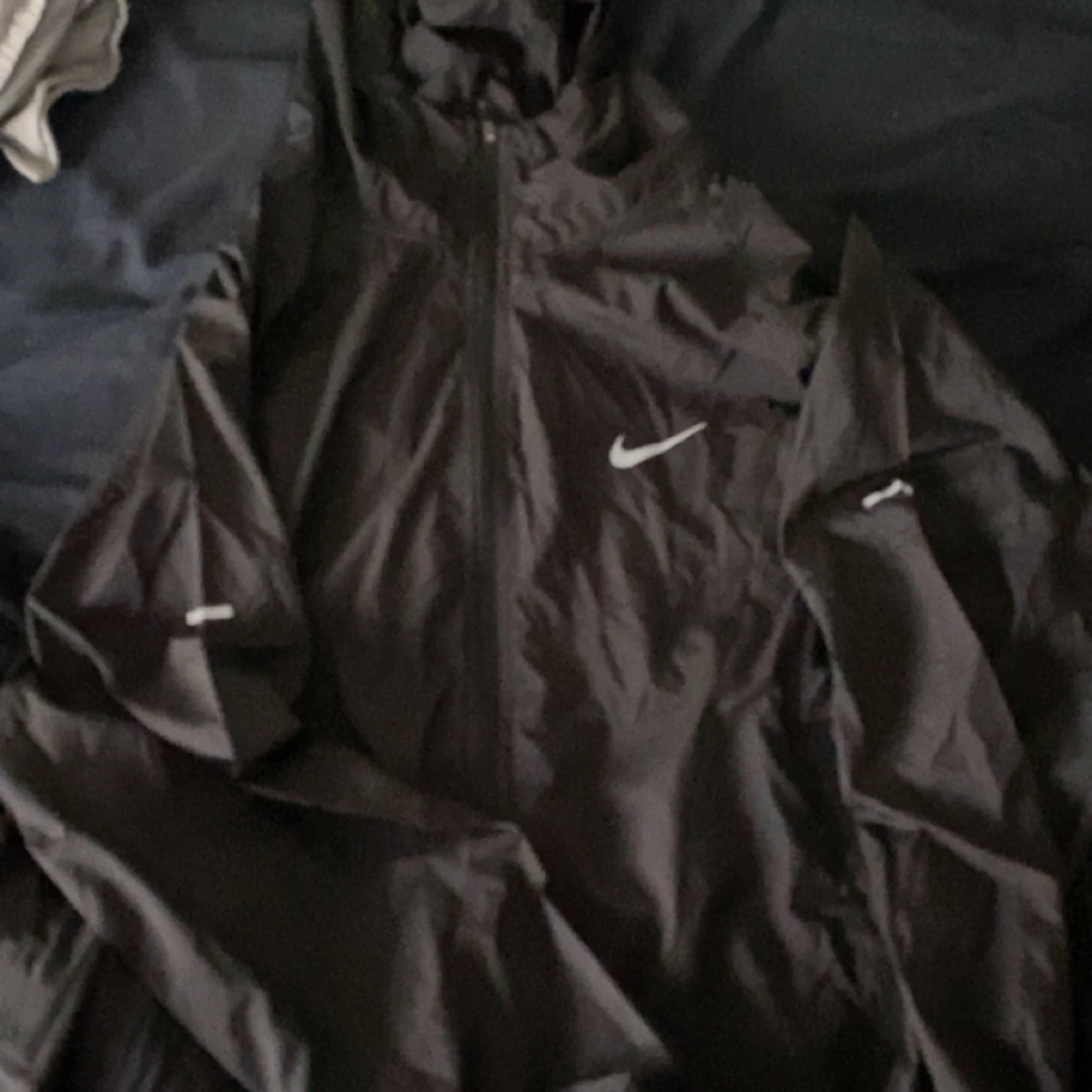 Svart Nike vindjacka med reflex