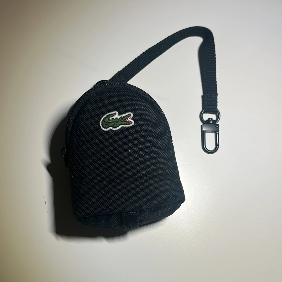 Svart myntväska från Lacoste