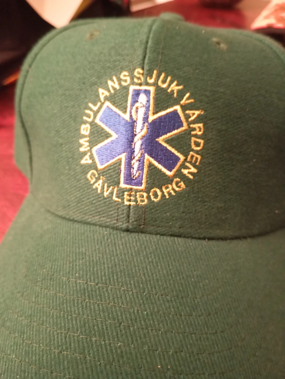 Grön keps Ambulanssjukvården Gävleborg