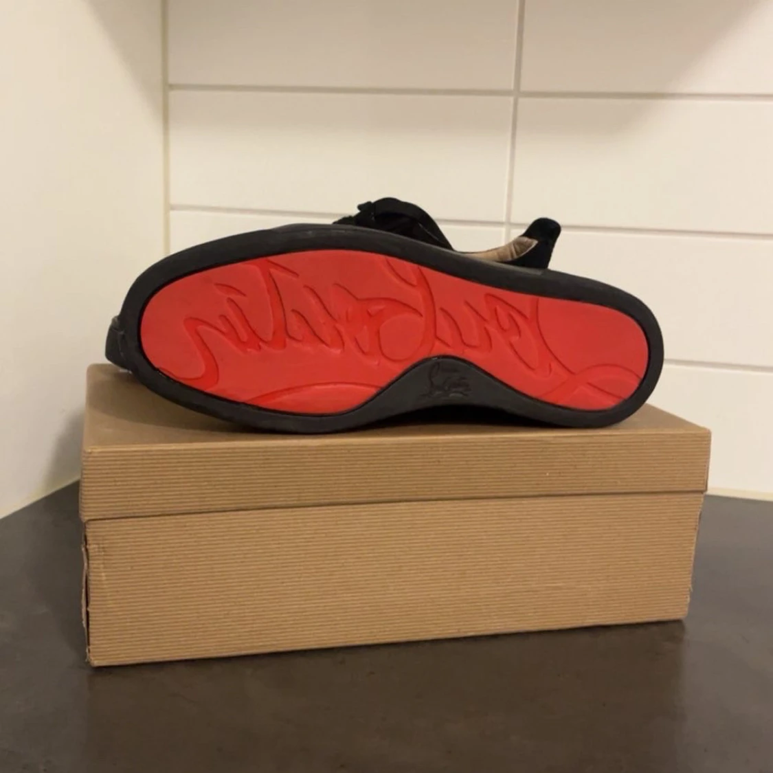 Svarta sneakers från Christian Louboutin - 1