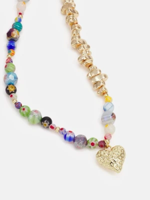 Halsband från Sweet Deluxe, guldfärgat - Unikt halsband med mix av färgglada pärlor och guldiga detaljer. Ena halvan består av chunky guldfärgade pärlor och andra av glaspärlor i olika färger och mönster. Väldigt fint och använt max 3 gånger, i fint skick! Justerbar kedja med karbinlås.