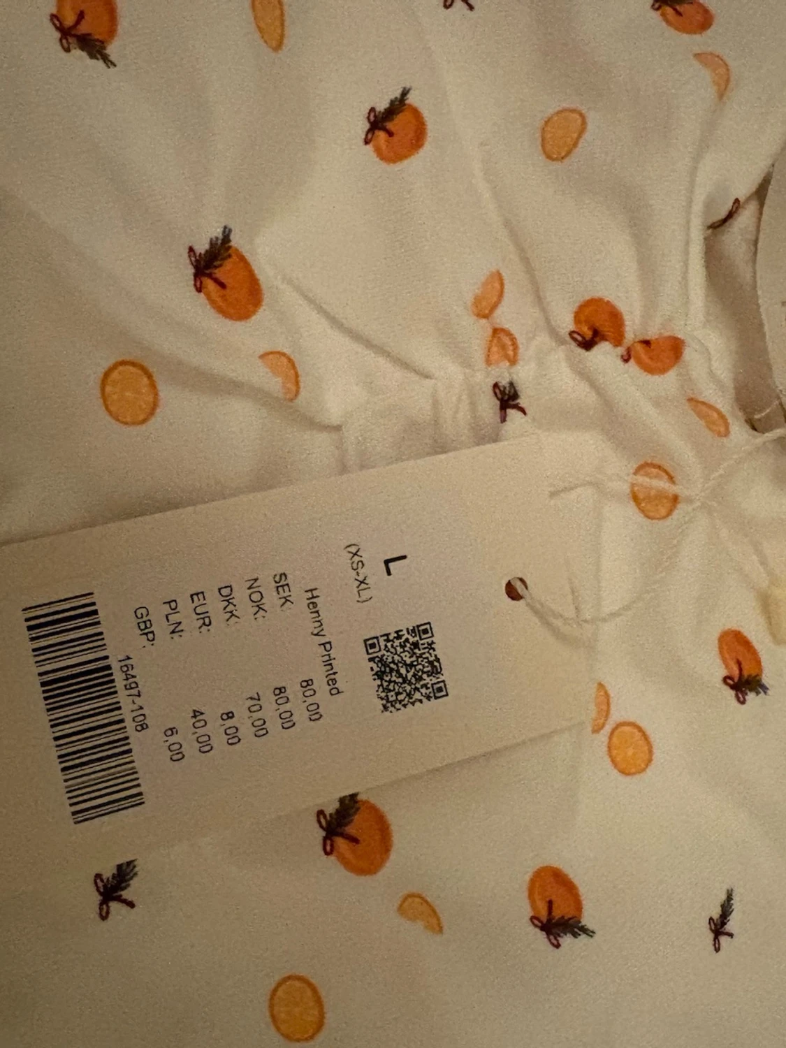 Vit linnetopp med apelsinmönster - 1