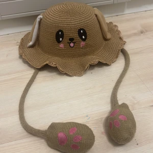 Brun söt kanin hat - En brun had som är en söt kanin. Om man vill ta up örat så trycker man på den rosa mjuka tassen