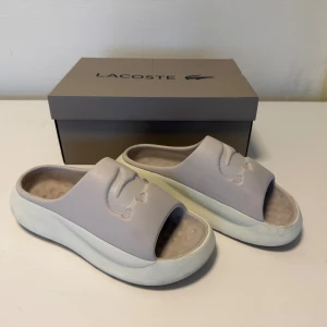 Lacoste Slides - Selling Lacoste Serve Slides Off-white color Okay condition  Size EU 46; US 12; UK 11 Price negotiable  Feel free to contact me