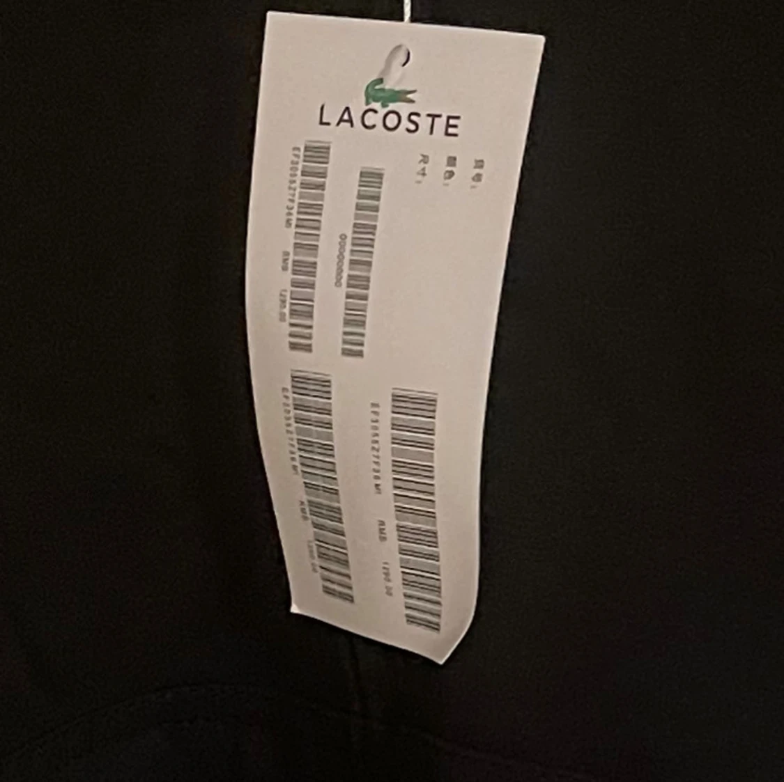 Svart kofta från Lacoste  - 1