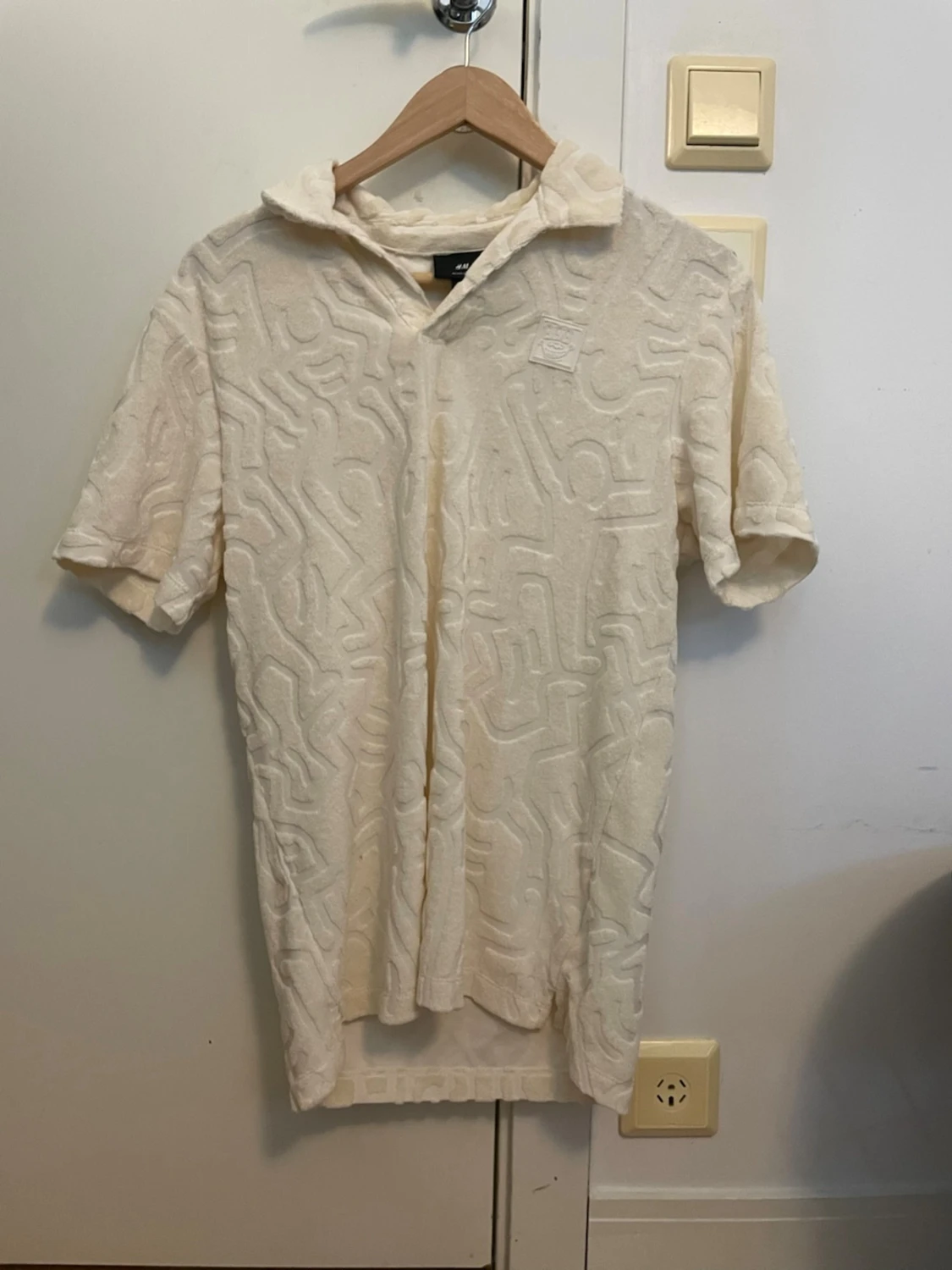 Beige frotté polotopp med mönster