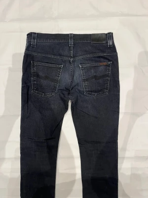 Nudie Thin Finn Jeans Black Men's - Begagnade svarta jeans, modell Thin Finn i smal passform.