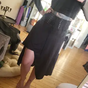 Unkown brand. Black assumetric skirt. Condition new, thick fabric. In size M fits more towards S