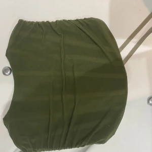 Korsett  - En grön korsett i storlek M/L  Oanvänd 