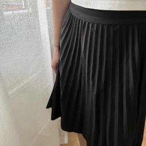 Plisserad kjol - Köpt på en marknad, väl omhändertagen 