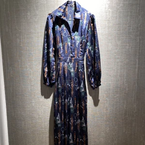 Jumpsuit | FashionNova - En flowy jumpsuit från FasionNova med ett jättecoolt mönster. Den har även en snören där bak som man kan knyta. Pris kan diskuteras.