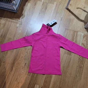 Ny rosa tubtröja - Nya rosa tubtröja passar 6 år