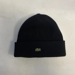 Lacoste mössa - Relativt ny, bra skick 