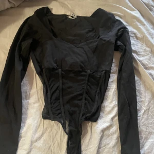 Body - En body från asos, aldrig använd.