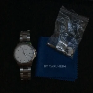 Carlheim klocka - Klockan är helt ny, bra skick, följer med verktyg så man kan göra klockan större eller mindre i storleken