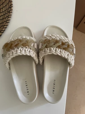 Inuikii tofflor - Inuikii tofflor, använda en gång  Storlek 38