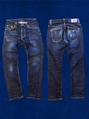 Nudie Grim Tim Selvage jeans - Säljer ett par mörkblå Nudie Grim Tim Selvage, Sjul wash! Storleken är w30 L30 bara att skriva till mig om du har någon fråga eller fundering angående jeansen! Pris kan självklart diskuteras! 