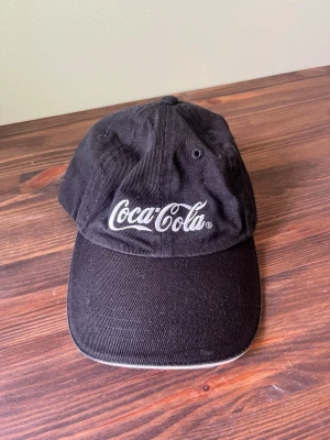 Keps, Coca-Cola - Svart keps från Coca-Cola. 