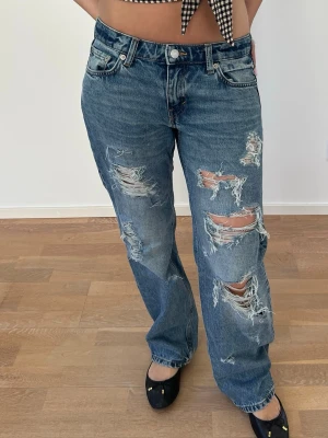 Baggy slitna jeans med hål - Baggy jeans med slitningar och kedjor Midjemått:39-40cm Innerbensmått:72cm